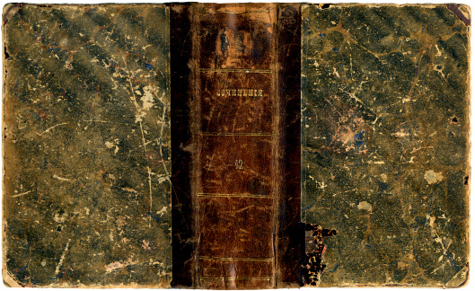 Cover of an old book: leather spine with clearly visible number (12) and inscription (