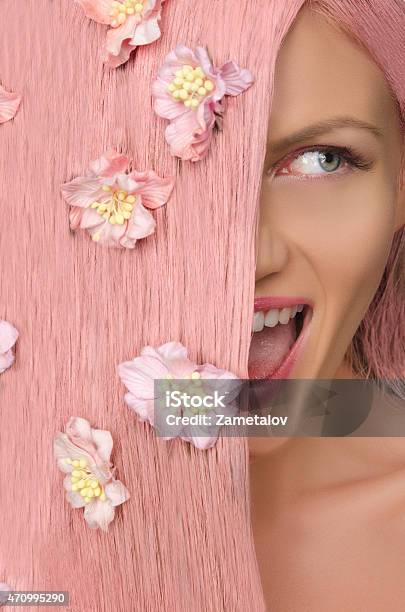 Woman With Pink Hair And Flowers Looking To Side Stock Photo - Download Image Now - 20-29 Years, 2015, Adult