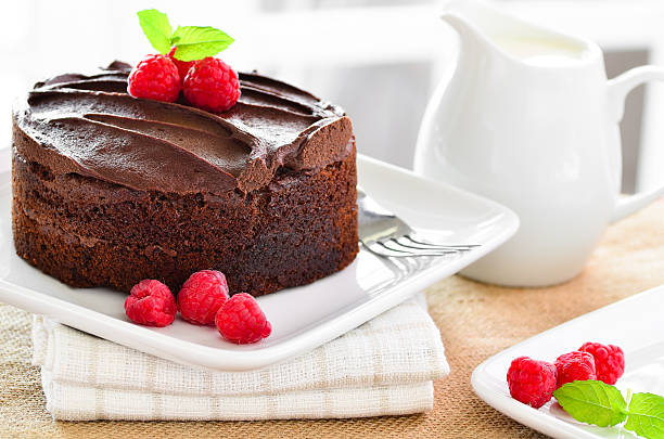 istock Fresh home made sticky chocolate fudge cake with raspberries 470995386