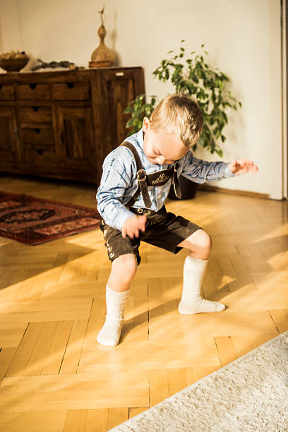 istock Young Boy Wearing Lederhosen at Home 470997038