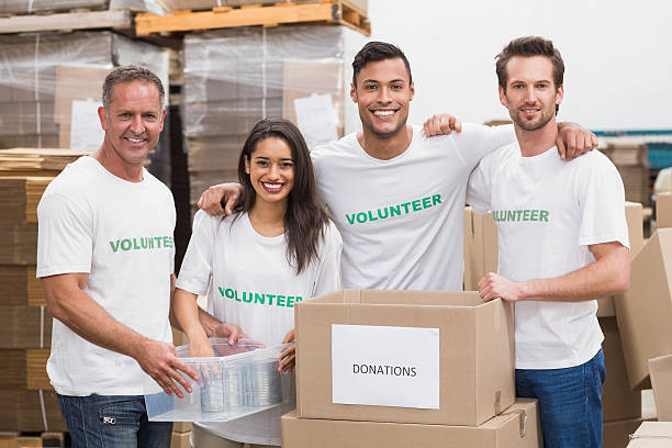istock Team of volunteers smiling at camera 470997334