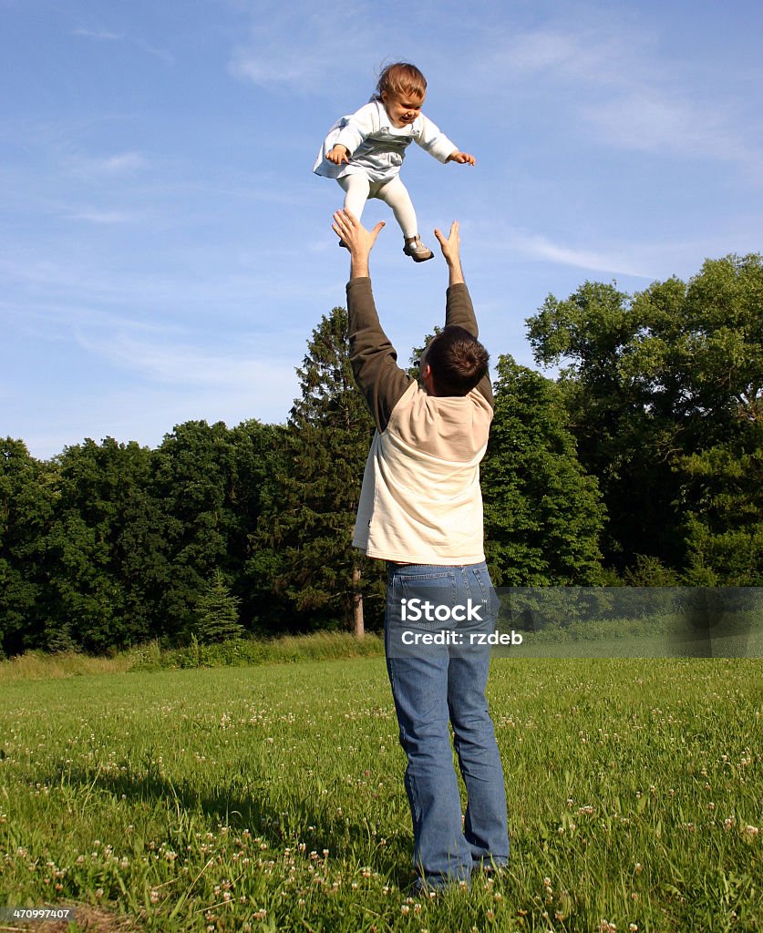 Father Playing with Kid Father with child. Blue Stock Photo