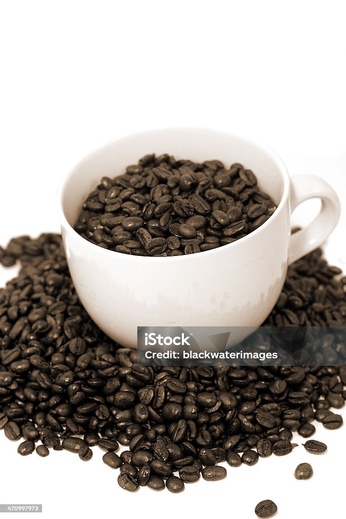 Sepia Coffee Sepia toned coffee mug and beans. Addiction Stock Photo