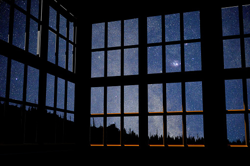 Milky way and stars beyond a rendered model of a window
