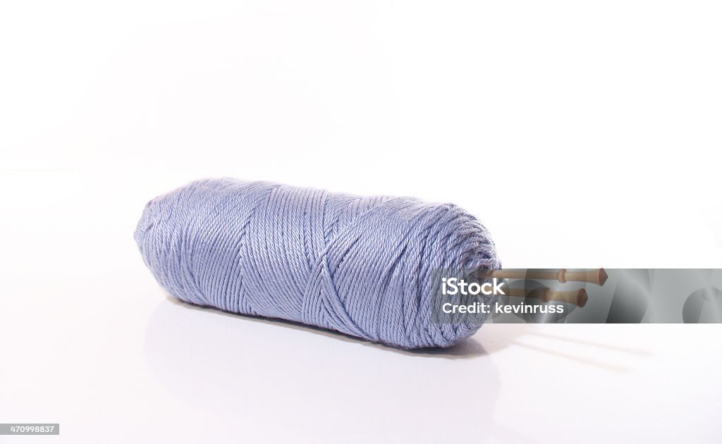 Bundle Of Gray Yarn With Wooden Knitting Needles Stock Photo
