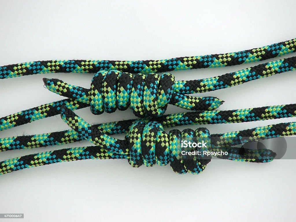 Rock Climbing Gear: Knots 2 Rock climbing "cordage" tied into knots, wider view. Anchor - Vessel Part Stock Photo