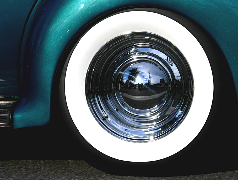 Classic car with round chrome hubcap