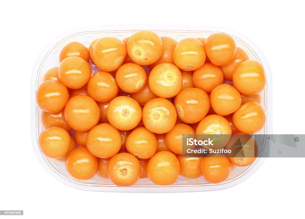 cape gooseberries Fresh golden cape gooseberries in a clear plastic container, isolated on white. They taste kind of like a sweet tomato, are related to tomatillos, and grow with a papery husk surrounding the fruit. Gooseberries are known by many names, including "Chinese lantern," "physalis," "alkekengi," "strawberry tomato," "ground cherry," "husk tomato," "poha," etc. Gold Colored Stock Photo