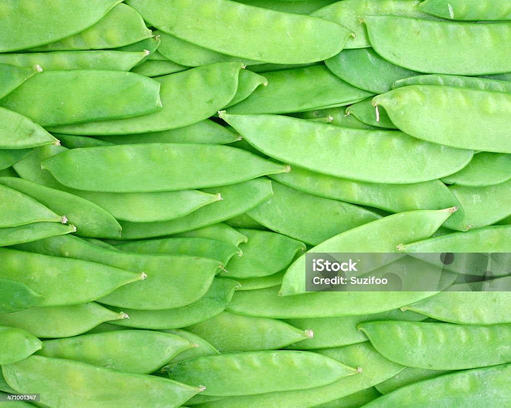 snow peas Fresh crisp green snow peas (also called "Chinese peas"). Backgrounds Stock Photo