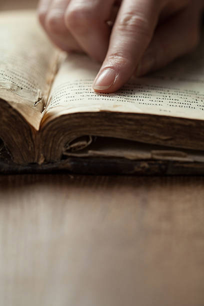 istock woman hands on bible 471006144