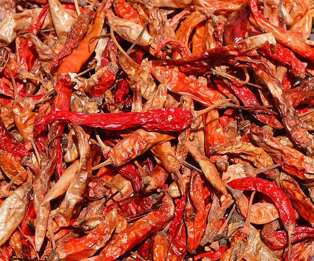 istock Dried red chillies as a textured food background. 471008414