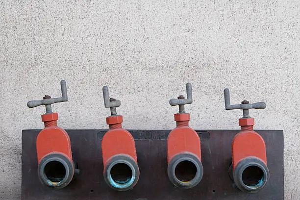 Photo of Four orange faucet outlets