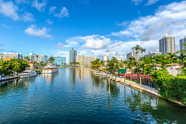 luxury houses at the canal in Miami Beach with boats luxury houses at the canal in Miami Beach with boats canal photos stock pictures, royalty-free photos & images