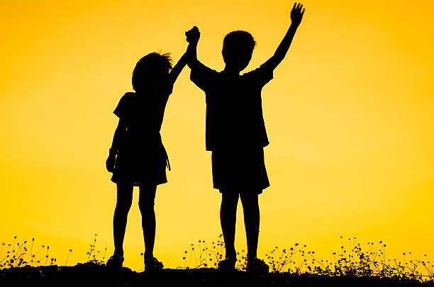 istock Little brother and sister silhouette 471009816