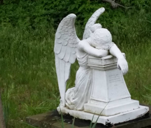 istock Statue of Despairing Angel 471010176