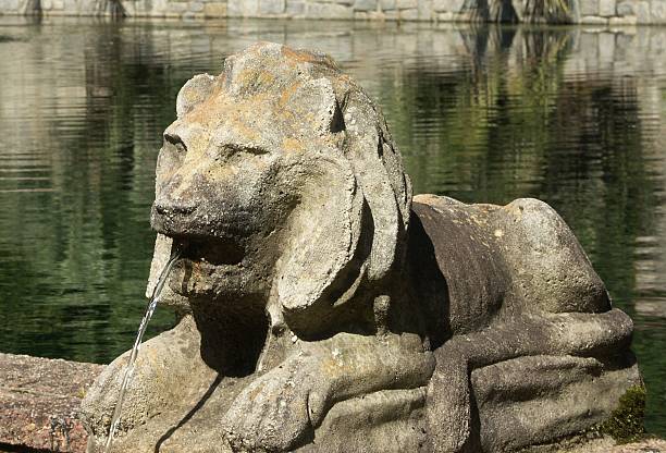 Detail from the Hundred Fountains, Villa d'Este, Tivoli, Italy. One of the faces aligned on a path in the garden grounds.