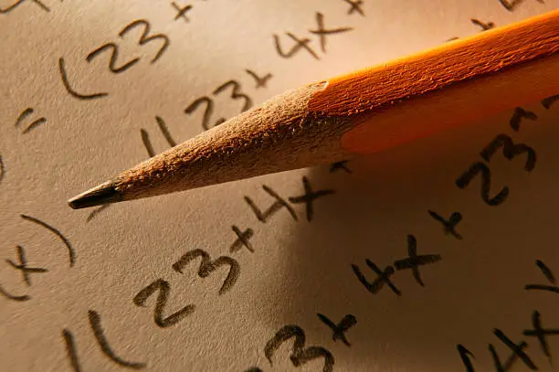 Pencil  resting over mathematical equation
