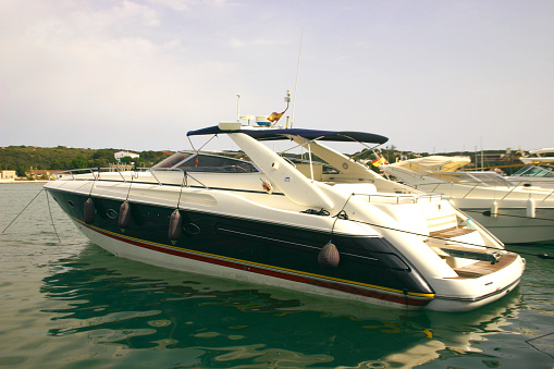 a shot of a speedboat moored in a harbour