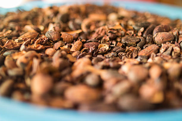 Cocoa Nibs on a blue platter stock photo