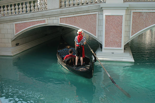 istock Gondolier couple and gondola 471014111