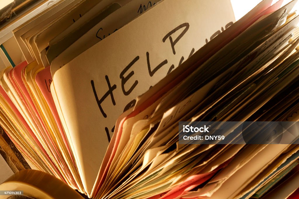 Searching for Help 2 Searching for help in a rolodex file A Helping Hand Stock Photo