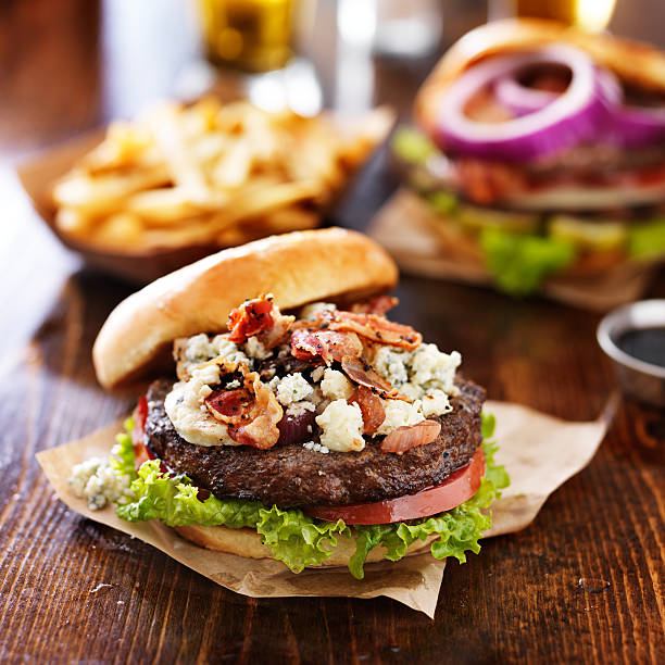 istock burgers and fries on pub table 471014358