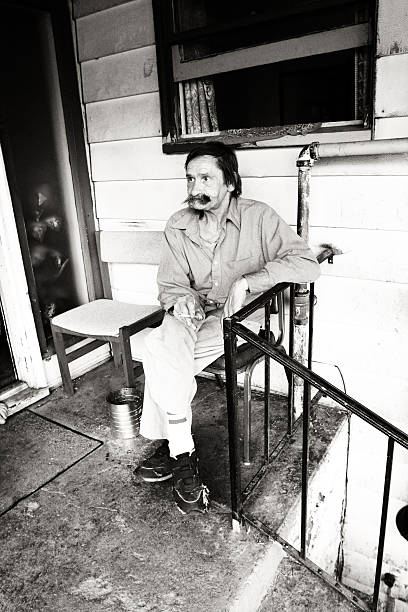 istock Old Man Sitting on a Porch 471015077