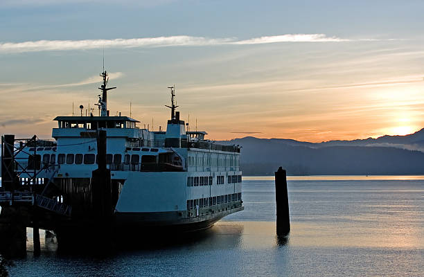 Ferry in sunrise stock photo