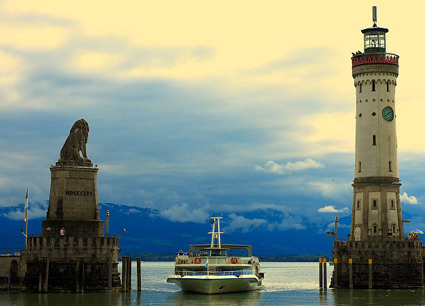 Ship comes to harbour Harbour of Lindau, Germany at the "Bodensee" (Lake Constance). Taken 2005 lindau lighthouse stock pictures, royalty-free photos & images