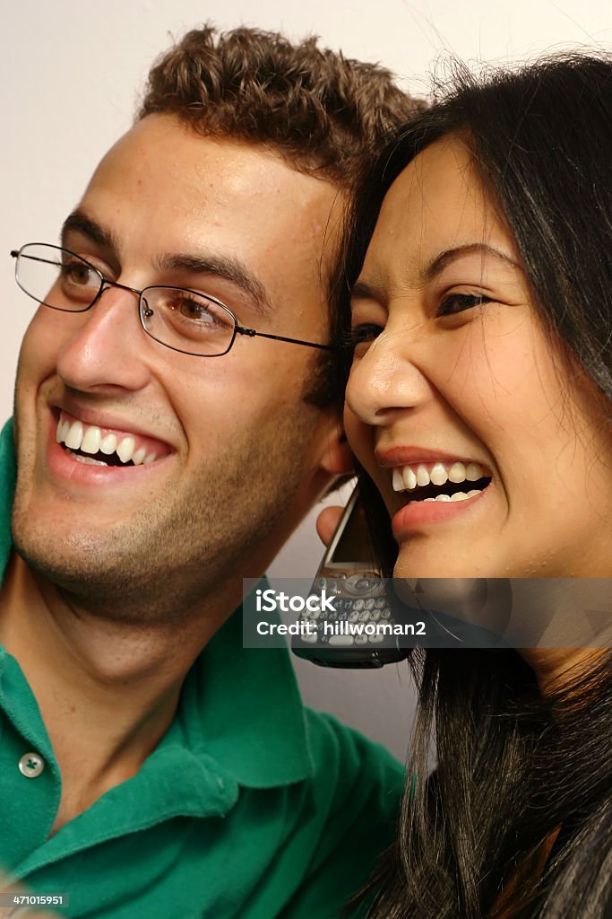 Funny Conversation two people listening in on a funny conversation - shot in natural light Adult Stock Photo