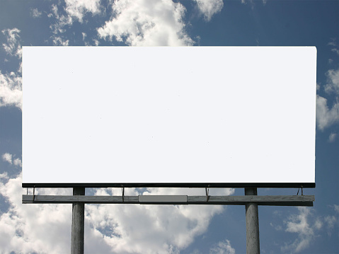 Photo of a blank billboard and rolling clouds. just add your advertisement.