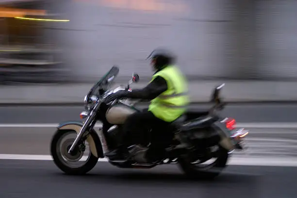 Photo of a moving motorcyclist taken in Europe with a Canon EOS 10D. Trying to capture motion as it pertains to moving traffic.