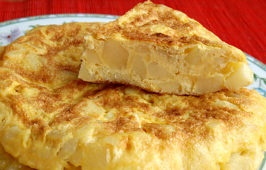 Spanish typical food; an omelette made with fried potatoes and (sometimes), onion .It can be eaten as a main course or, also, as an appetizer (“tapas”)appetizer, a \