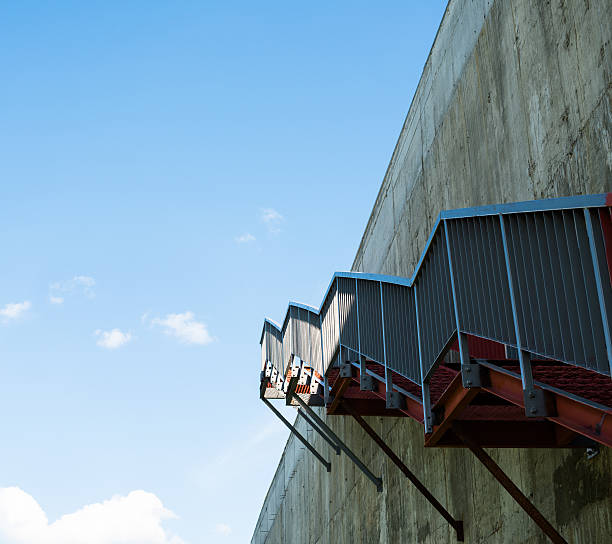 istock Metal stairs on the gray concrete wall 471018976