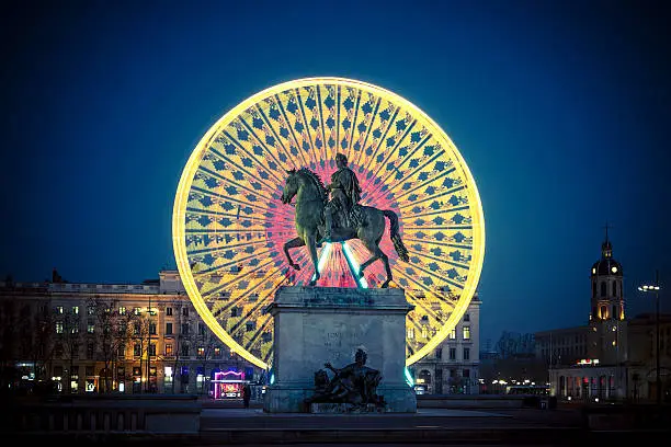Famous Place Bellecour statue of King Louis XIV by night, Lyon France