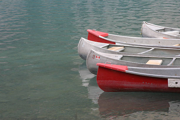 canoes on lake stock photo