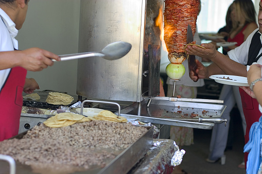 mexican taqueria, or tacos restaurant, here serving pork meat \