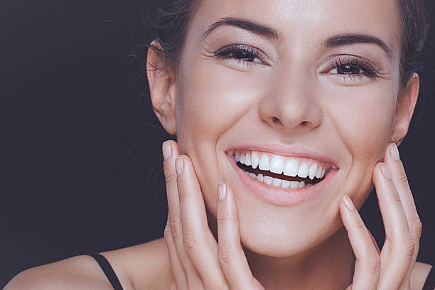 Natural young woman with perfect smile and clean healthy skin stock photo