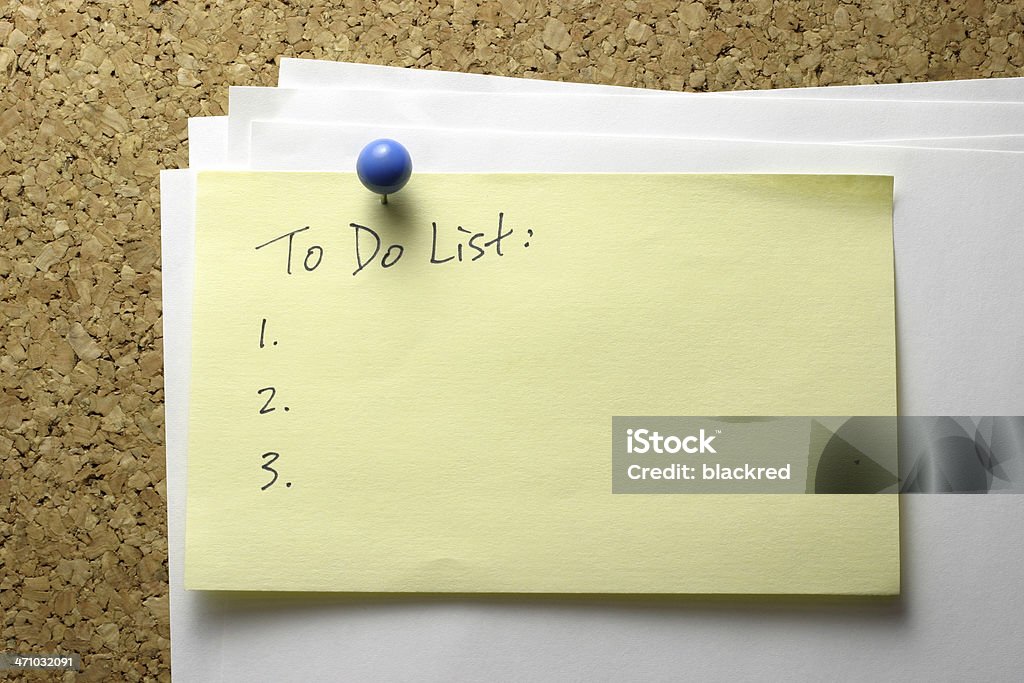 To Do List "To Do List" written on sticky note and pinned up on corkboard. Adhesive Note Stock Photo