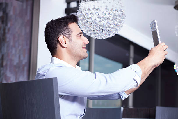 istock Businessman Taking a Selfie  With His Digital Tablet 471032110
