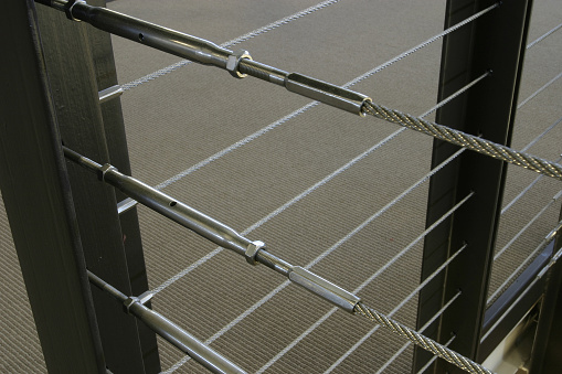 A modern steel cable stair railing detail