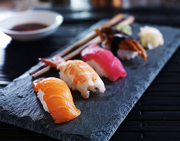 istock Close-up or assorted sushi nigiri on black slate 471034804