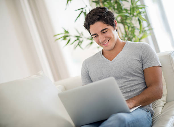 istock Man working at home on a laptop 471035078