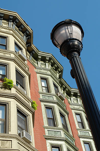 istock stately townhomes with lampost 471037645