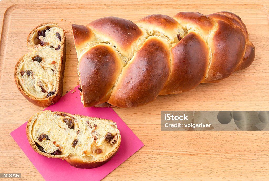 Braided bread with fruits and nuts. Freshly baked sweet braided bread loaf with fruits and nuts. 2015 Stock Photo