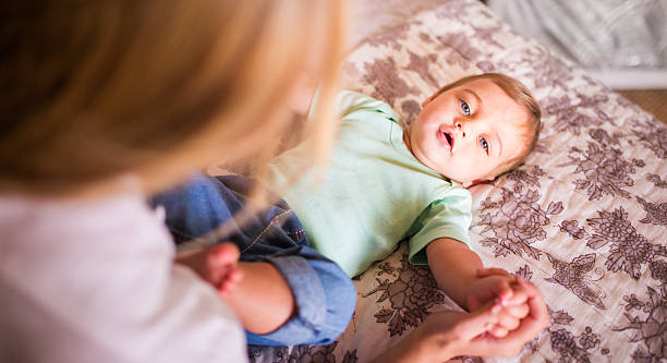 istock Baby boy and his mother holding hands 471039510