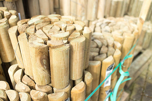 istock wooden log roll lawn edging ready for sale 471039538