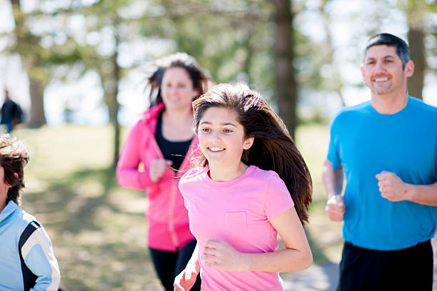 istock Family Jogging through Park 471040262