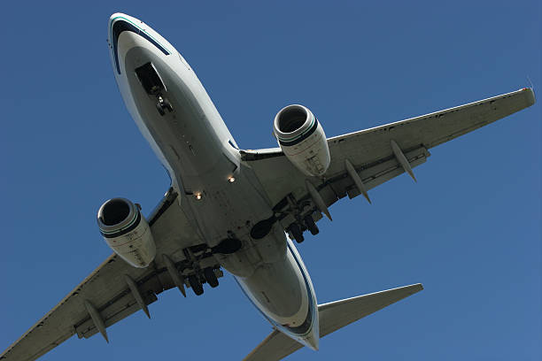 Undercarriage of an Approaching Airplane stock photo