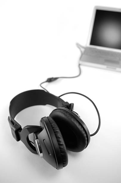 istock headphones attached to laptop 471044621